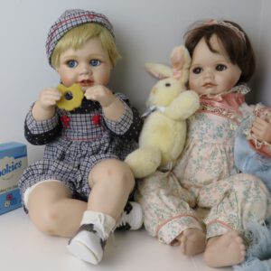 a pair of porcelain dolls