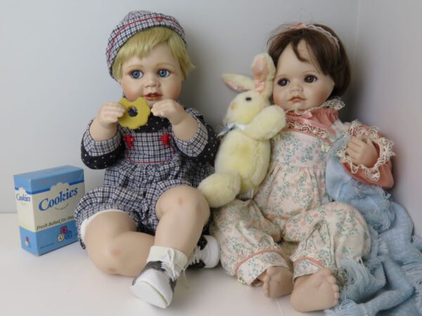 a pair of porcelain dolls