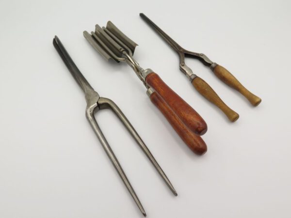 three vintage curling irons