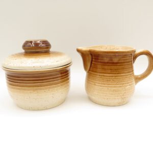 brown and tan ceramic cream and sugar set