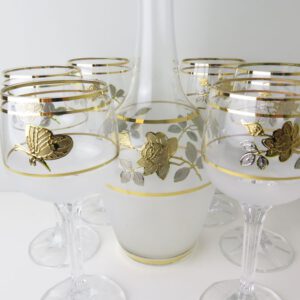 glass decanter and glasses decorated in gold