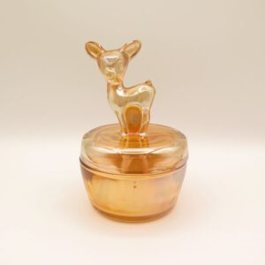 iridescent glass container with a deer on top