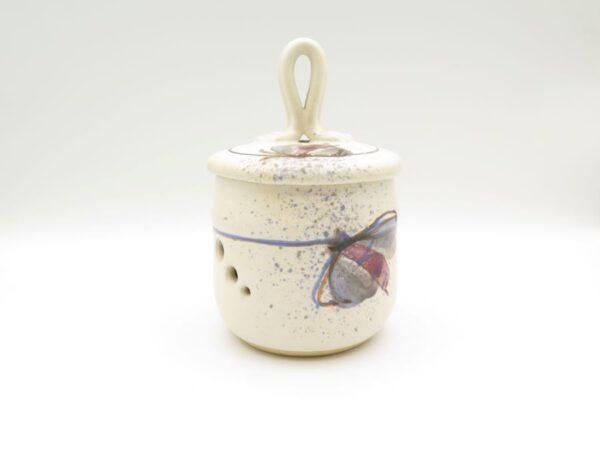 ceramic garlic keeper decorated with a butterfly