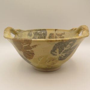clay bowl decorated with leaves