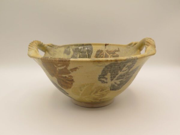 clay bowl decorated with leaves