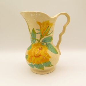 ceramic pitcher decorated with yellow roses