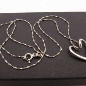 silver necklace with heart shaped pendant