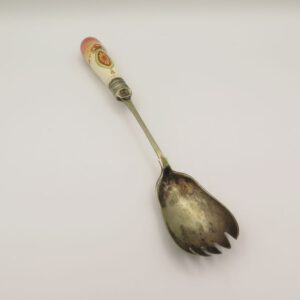 metal serving spoon with a ceramic handle