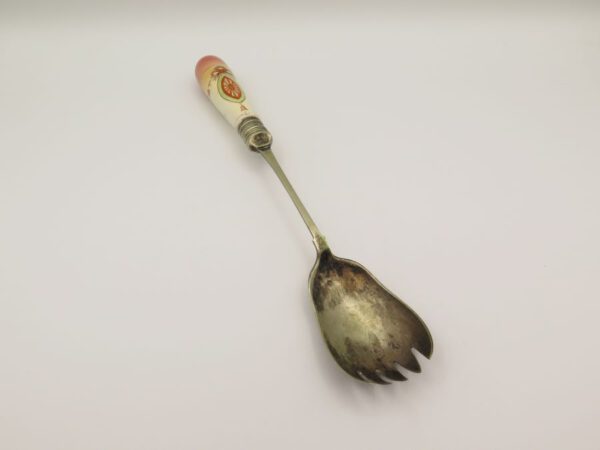 metal serving spoon with a ceramic handle