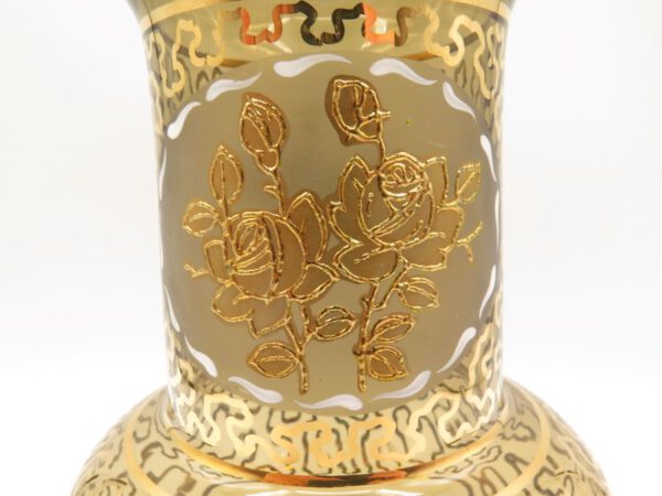 brown glass vase decorated in gold